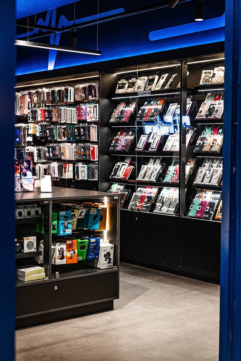 Store Displays Various Phone Cases and Accessories on Shelves — JMB Electrical Services In Port Kembla, NSW