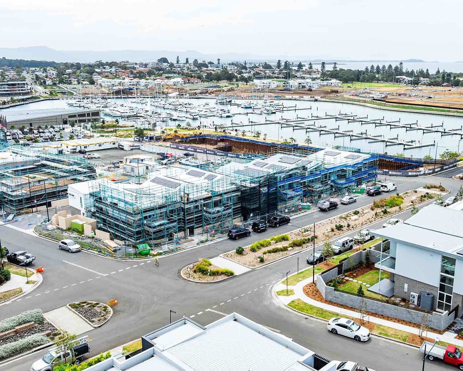Coastal Construction Site With Buildings Covered in Scaffolding — JMB Electrical Services In Port Kembla, NSW