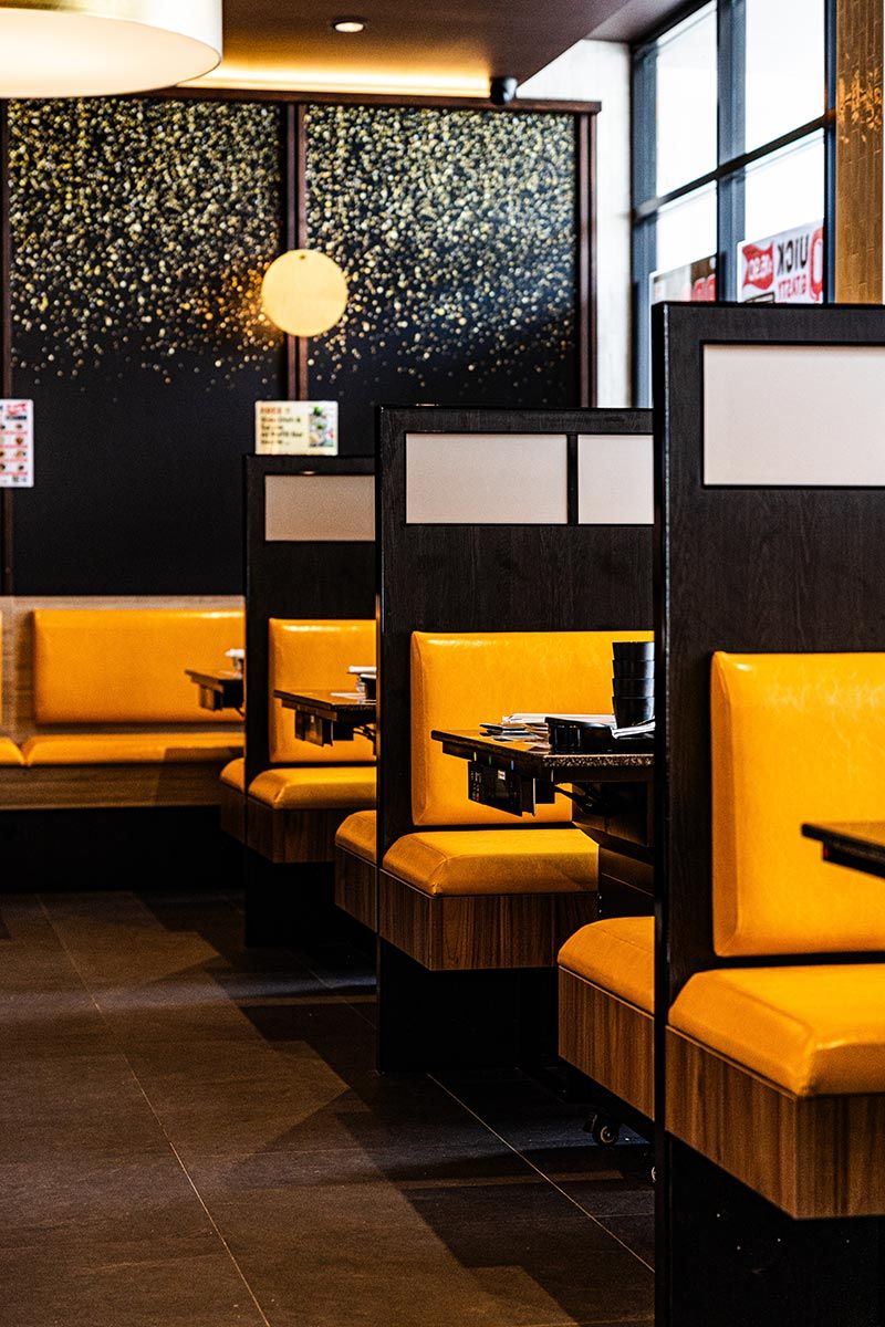 Cozy Restaurant Interior With a Gold-speckled Wall — JMB Electrical Services In Port Kembla, NSW