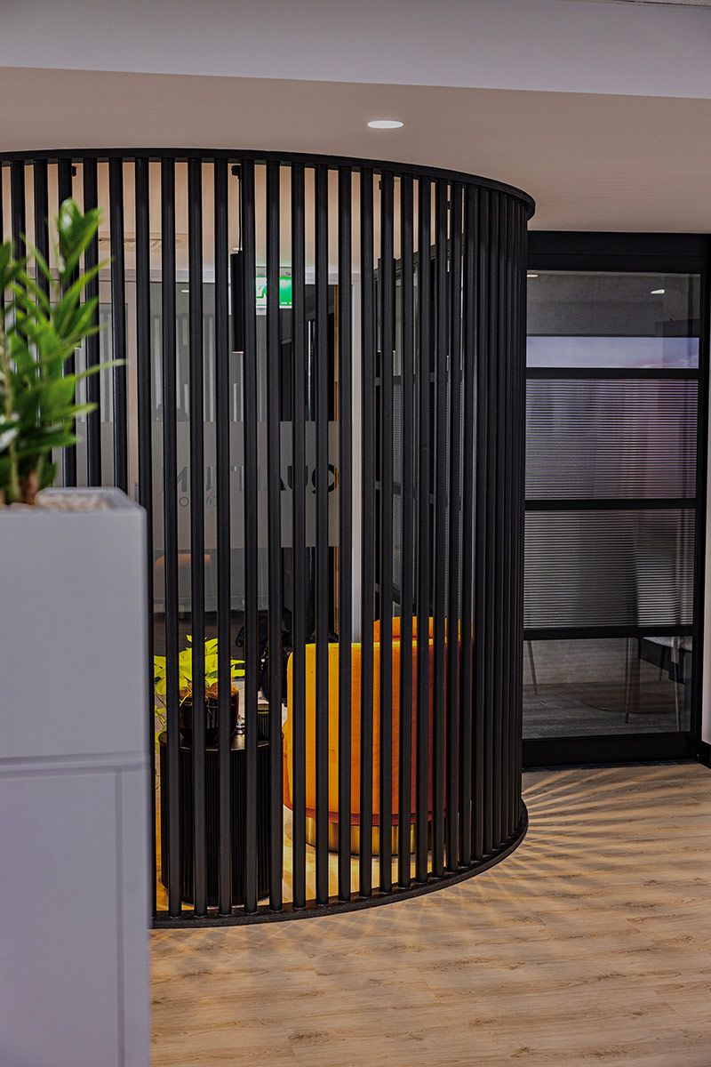 Office Interior Featuring a Black Slat Partition — JMB Electrical Services In Port Kembla, NSW
