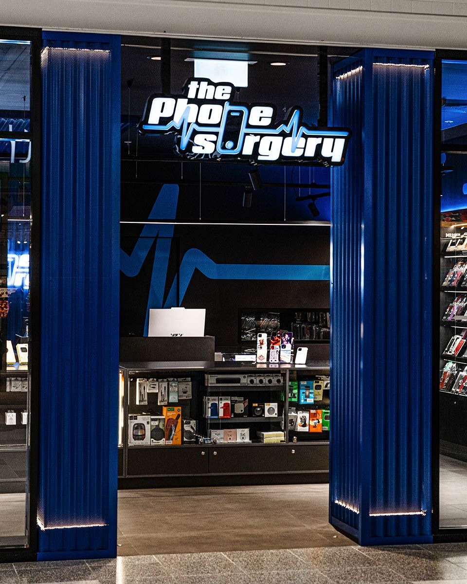 A Store With Blue Sign and Blue Curtains — JMB Electrical Services In Port Kembla, NSW