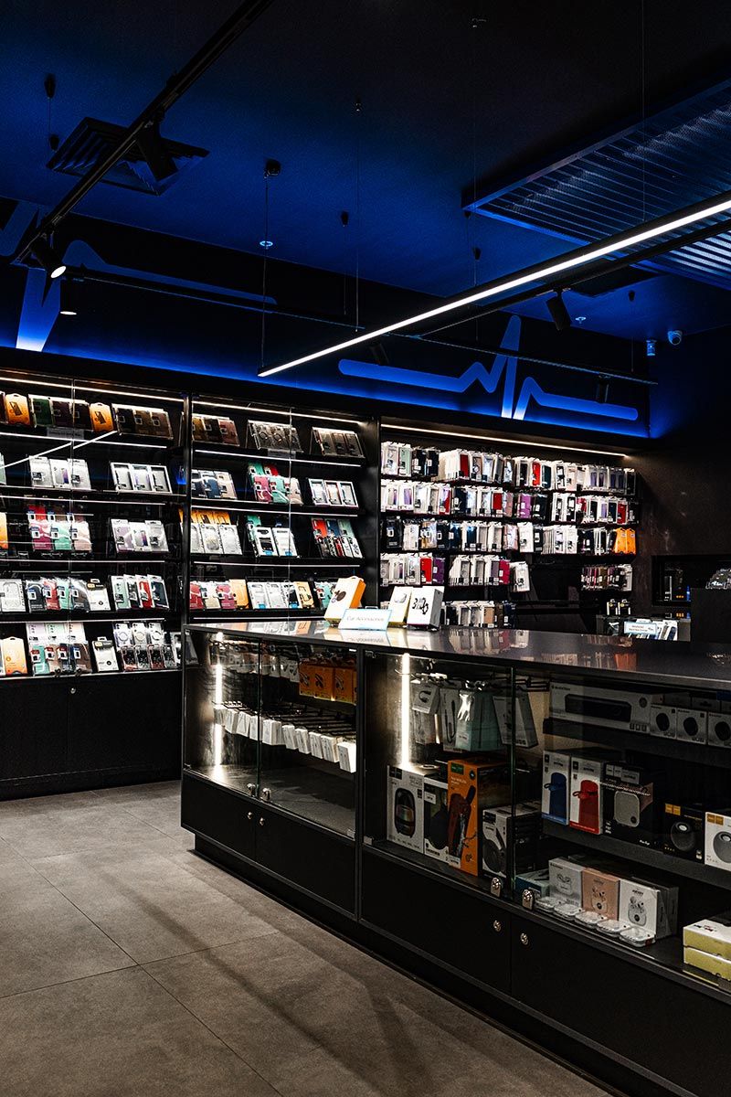 Store With Shelves Displaying Neatly Arranged Phone Cases and Accessories — JMB Electrical Services In Port Kembla, NSW