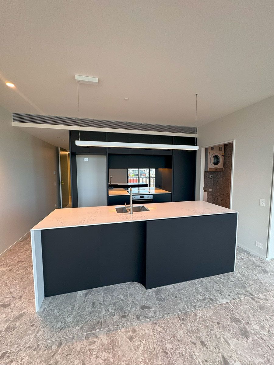 A Central Island Features a Built-in Sink — JMB Electrical Services In Port Kembla, NSW