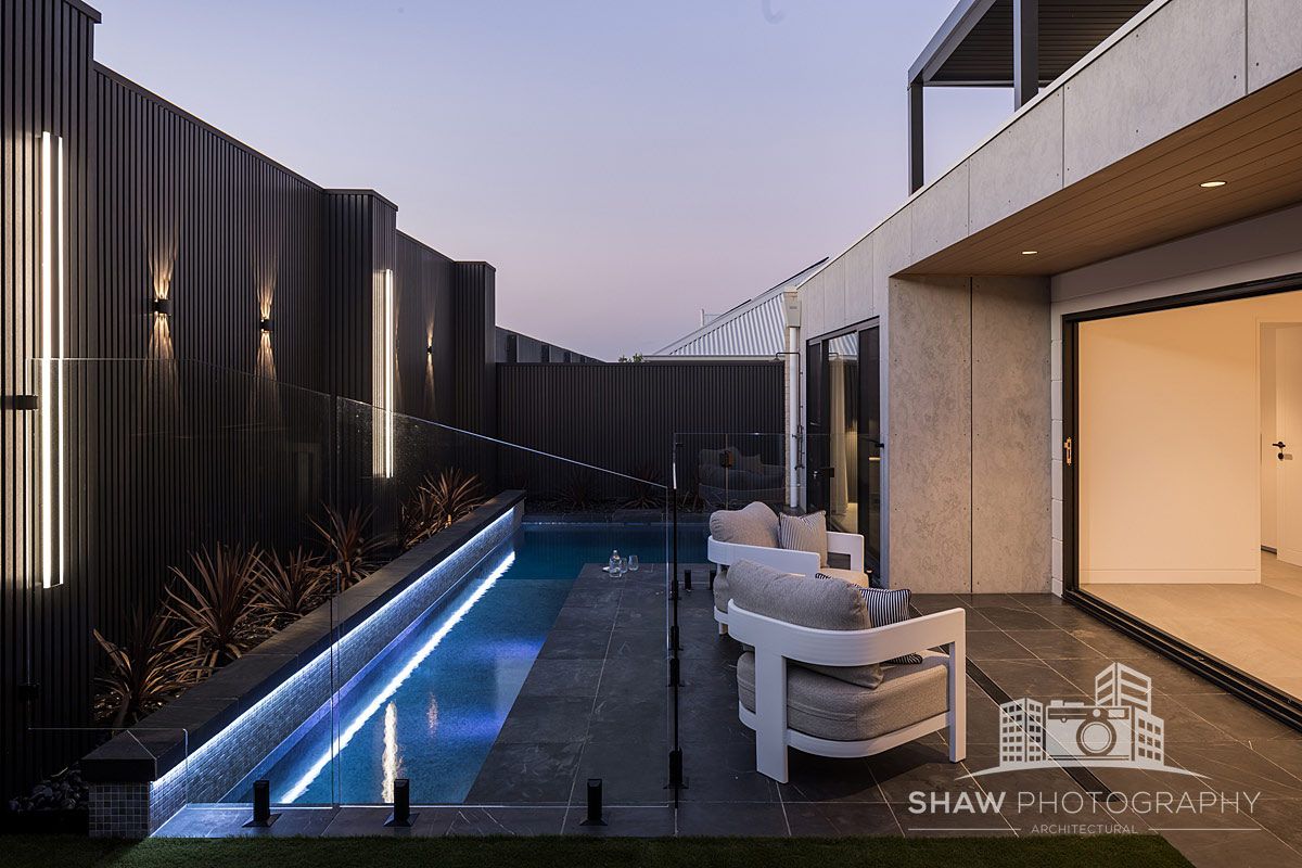 A Pool in the Backyard of a House — JMB Electrical Services In Port Kembla, NSW