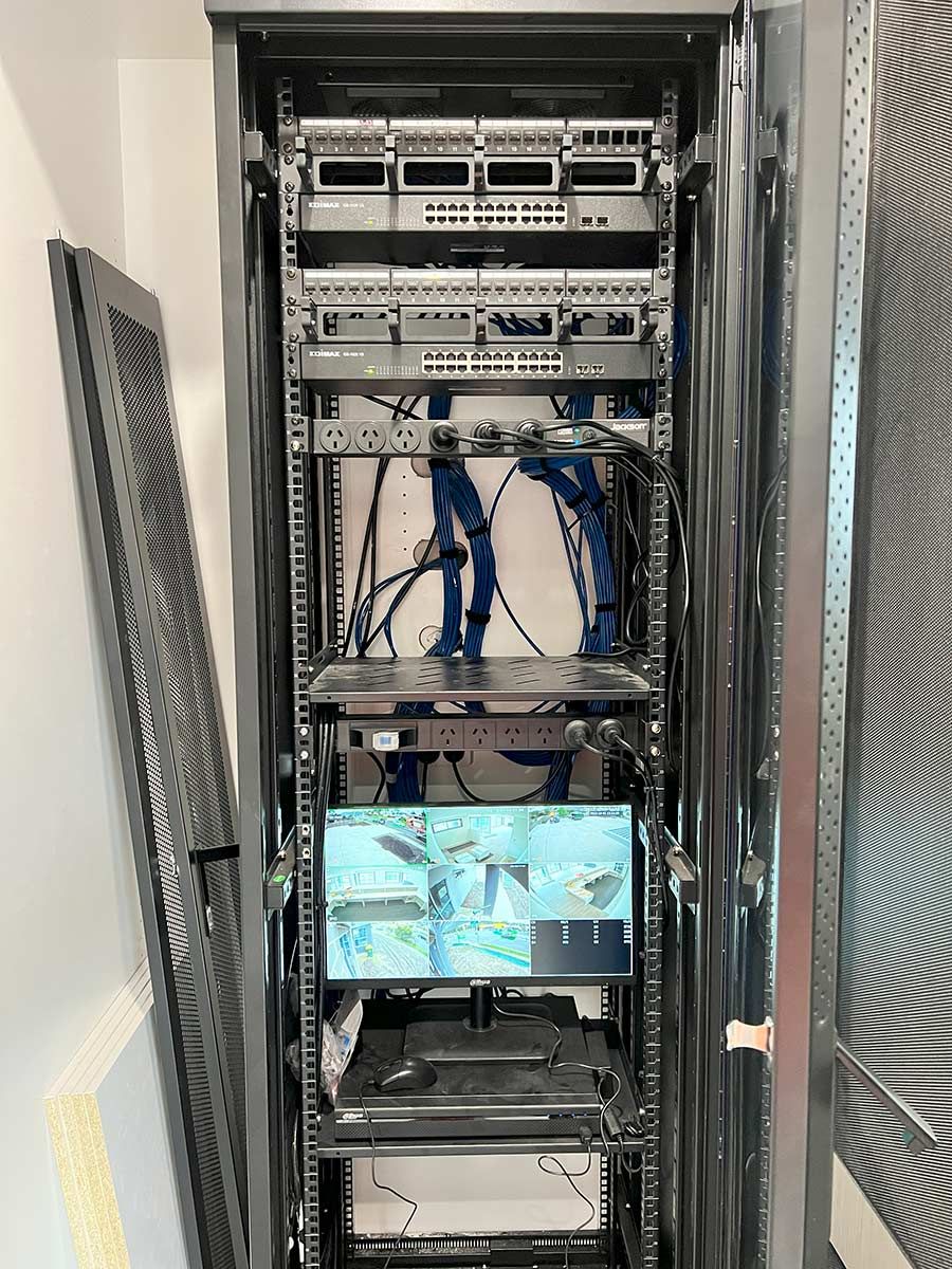 Server Rack With Network Switches and Organised Blue Cables — JMB Electrical Services In Port Kembla, NSW