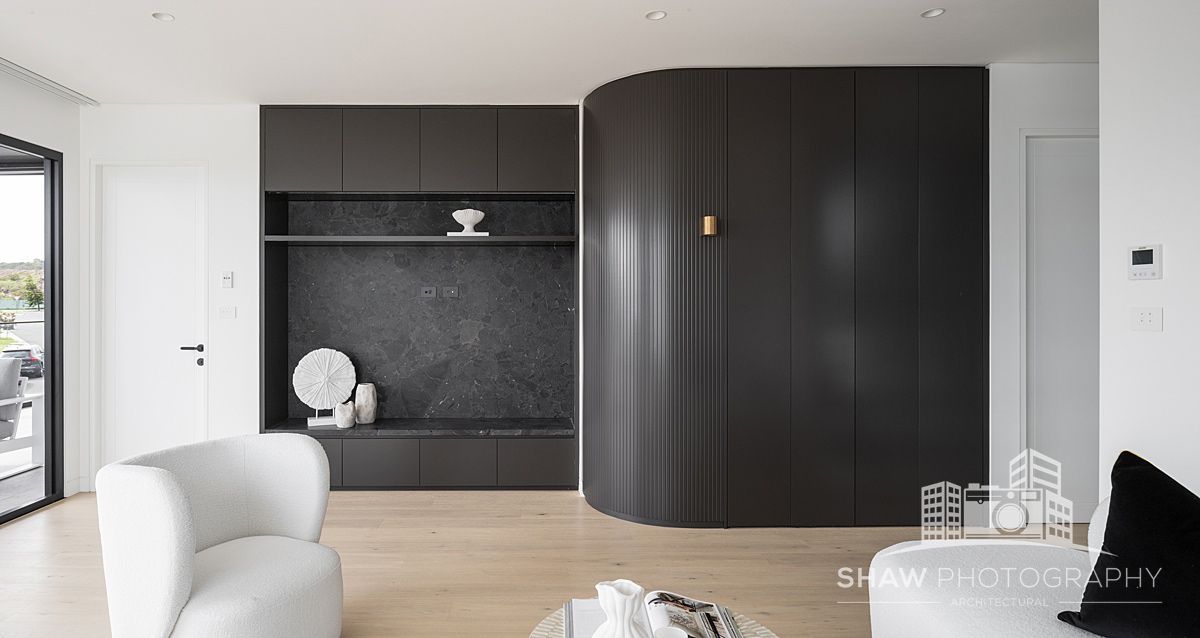 A Living Room With a White Chair — JMB Electrical Services In Port Kembla, NSW