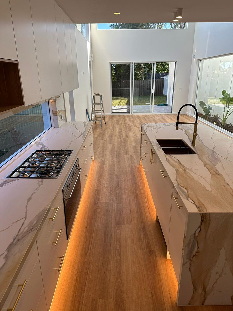 Modern Kitchen With Elegant Marble Countertops — JMB Electrical Services In Port Kembla, NSW