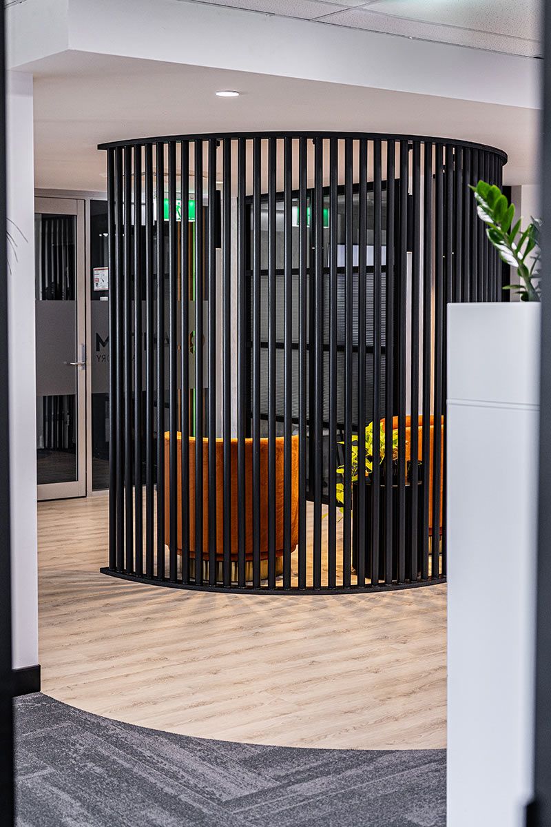 Modern Office Space With Circular Black Vertical Slats — JMB Electrical Services In Port Kembla, NSW