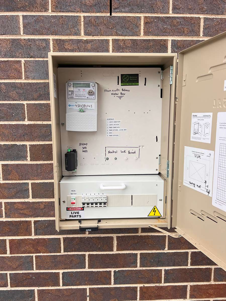 Electrical Meter Box Mounted on a Brick Wall — JMB Electrical Services In Port Kembla, NSW