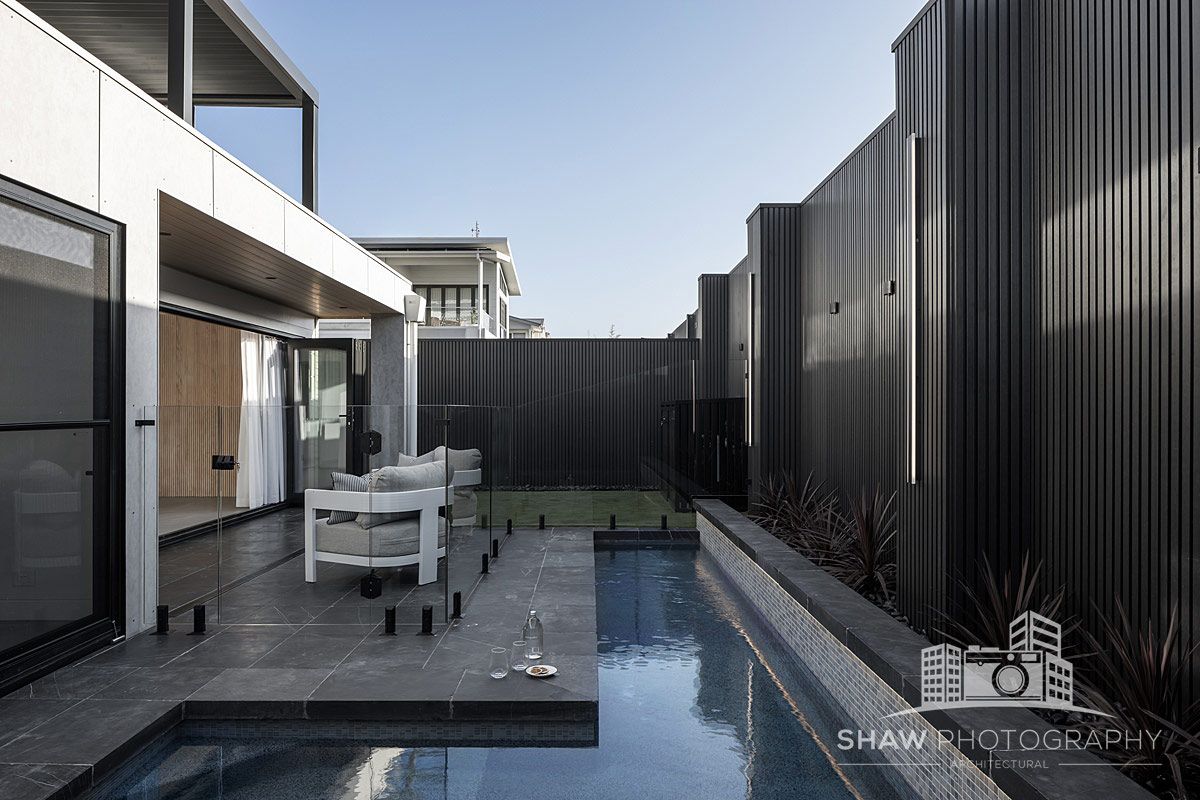 A Swimming Pool in the Backyard of a House — JMB Electrical Services In Port Kembla, NSW