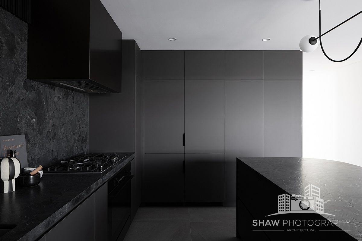 A Kitchen With Black Cabinets — JMB Electrical Services In Port Kembla, NSW