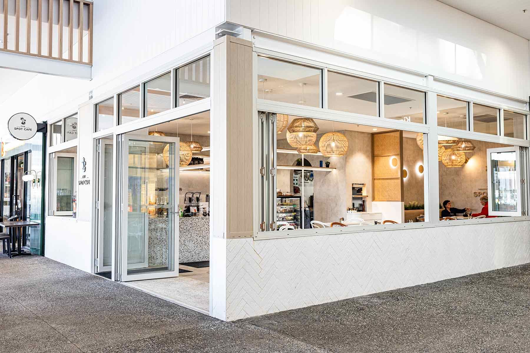 Cafe Corner With Open Glass Doors and Modern Decor — JMB Electrical Services In Port Kembla, NSW