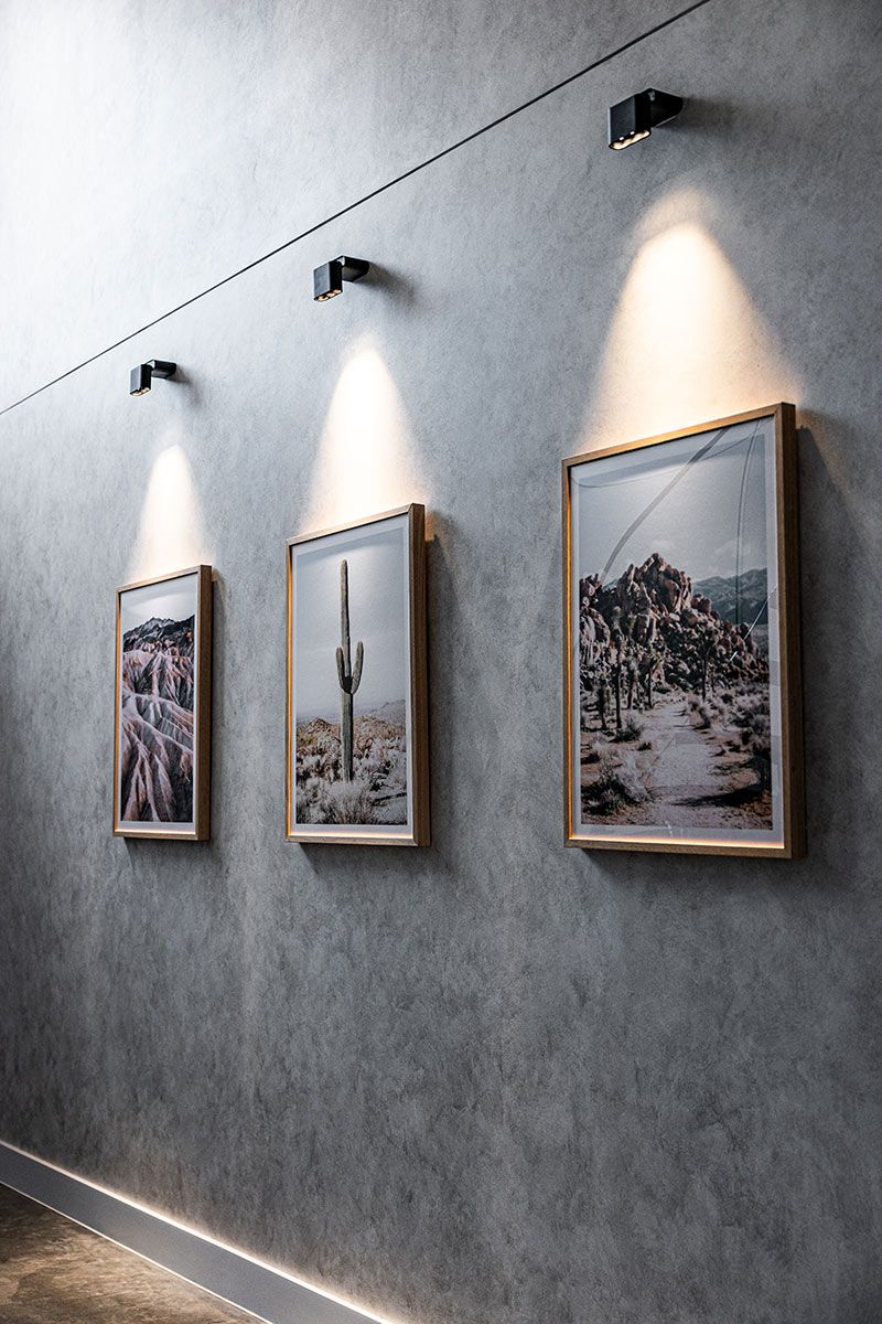 Three Framed Landscape Photos Are Mounted on a Gray Wall — JMB Electrical Services In Port Kembla, NSW