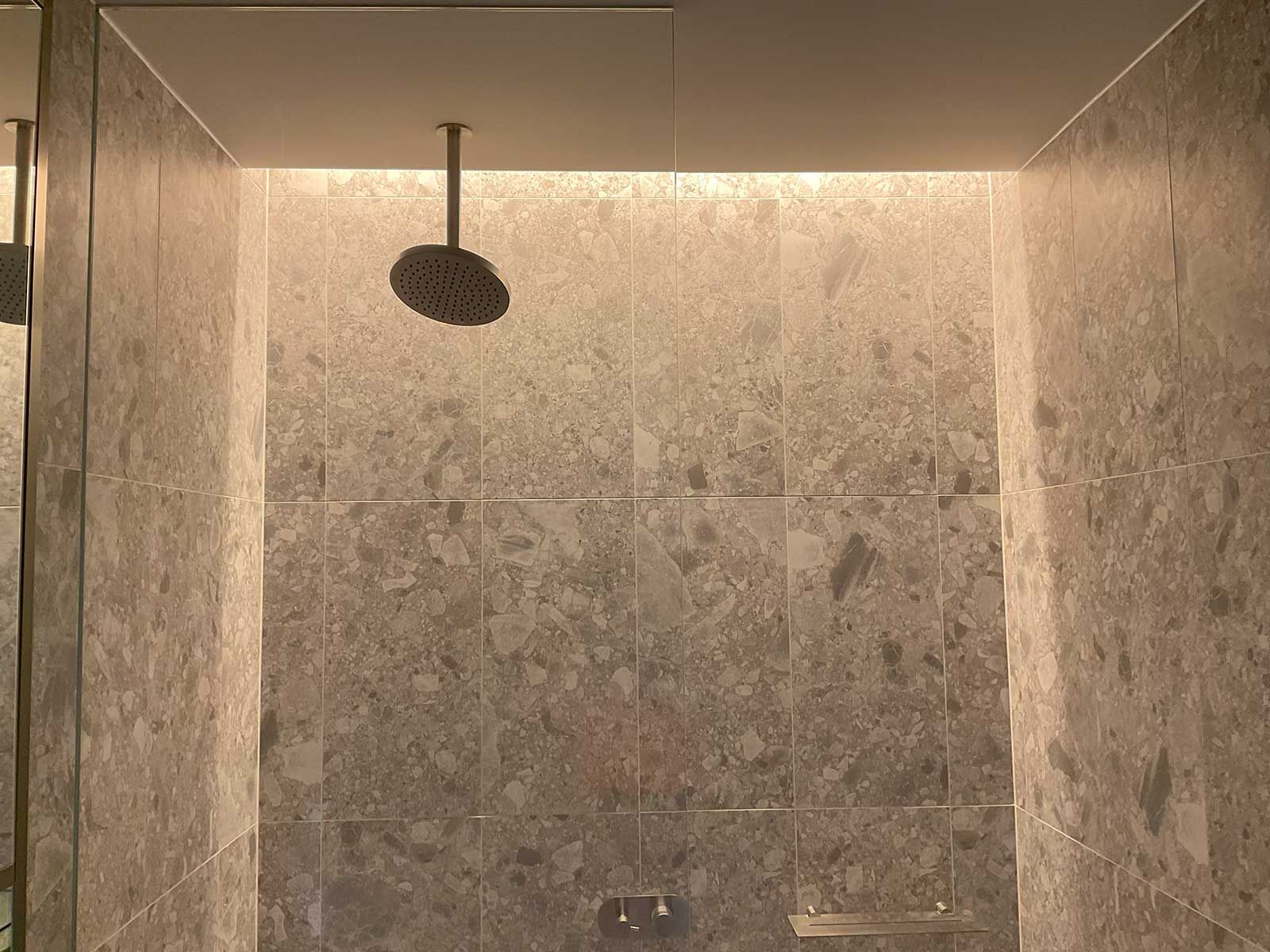 A Modern Shower With a Ceiling-mounted Rain Showerhead — JMB Electrical Services In Port Kembla, NSW