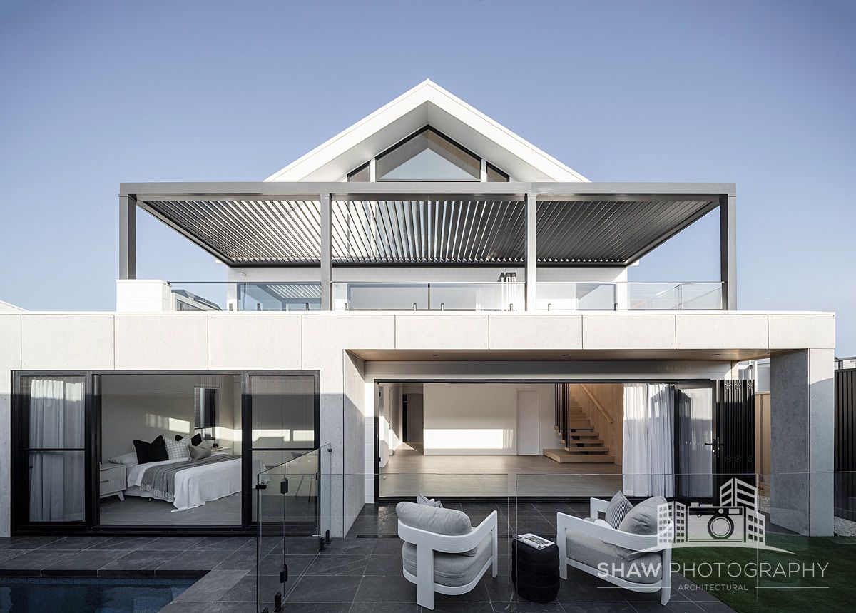 A Large White House With a Swimming Pool — JMB Electrical Services In Port Kembla, NSW
