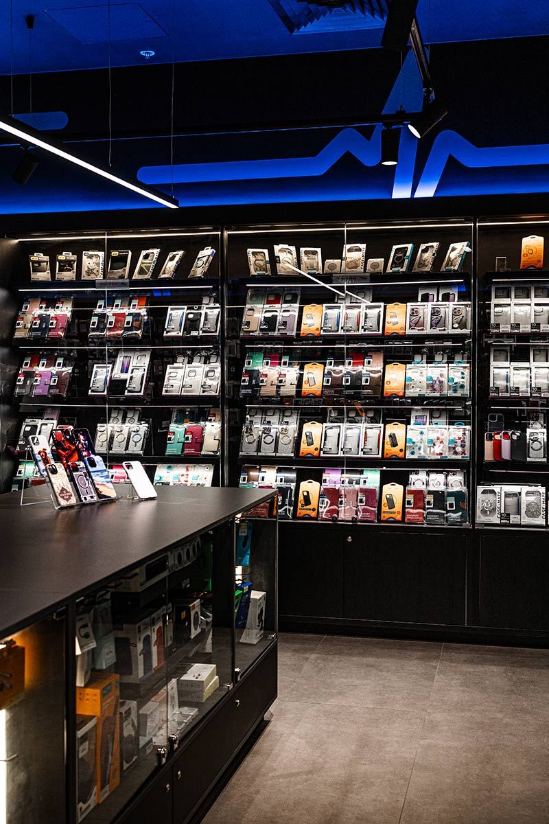 A Tech Store Lit With Blue Lighting — JMB Electrical Services In Port Kembla, NSW