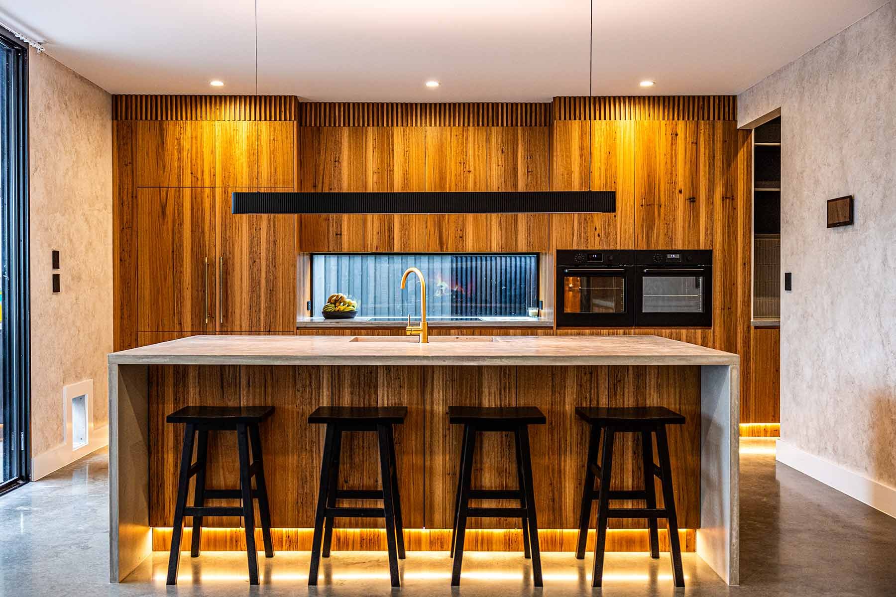 Modern Kitchen With a Large Wood Island — JMB Electrical Services In Port Kembla, NSW