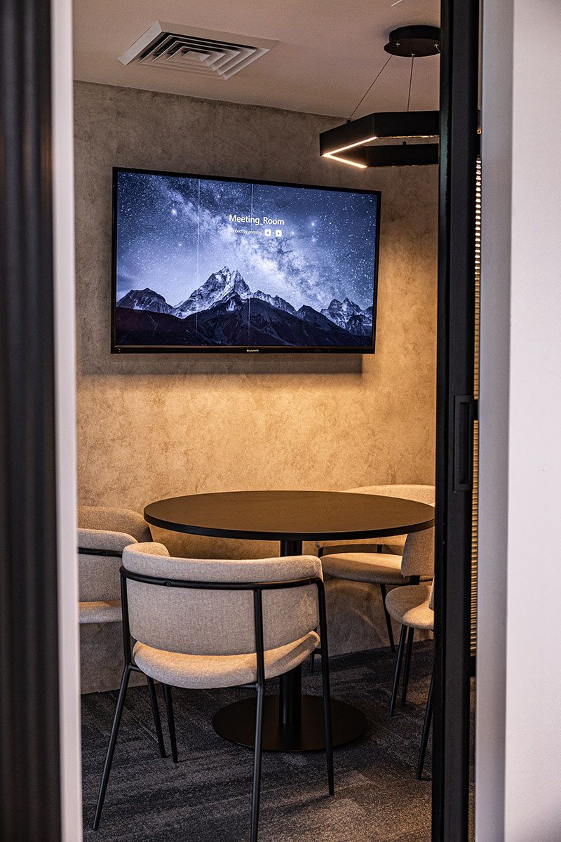 Meeting Room With a Round Table and Four Chairs — JMB Electrical Services In Port Kembla, NSW