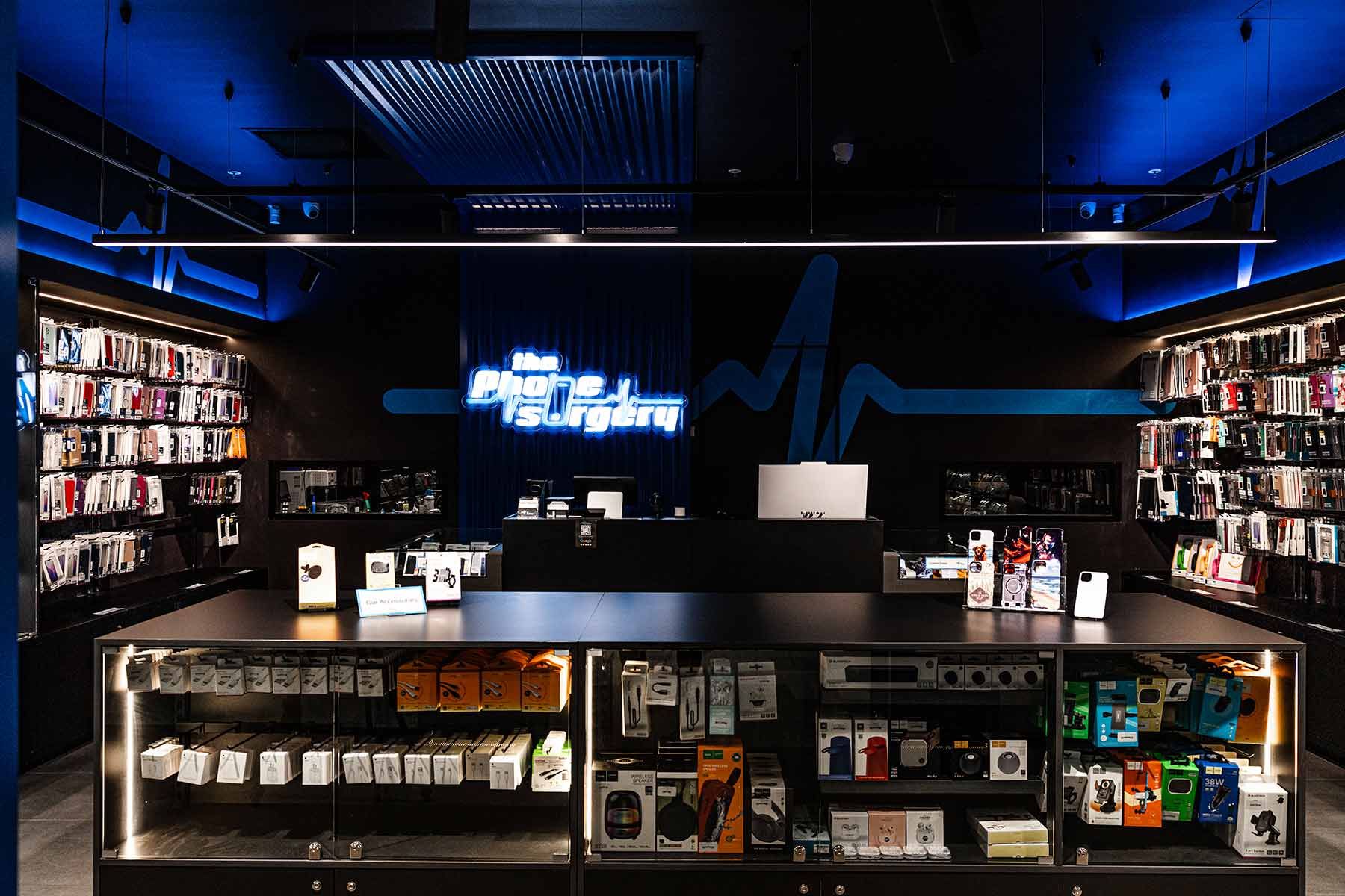 A Phone Accessory Store With Black and Blue Decor — JMB Electrical Services In Port Kembla, NSW