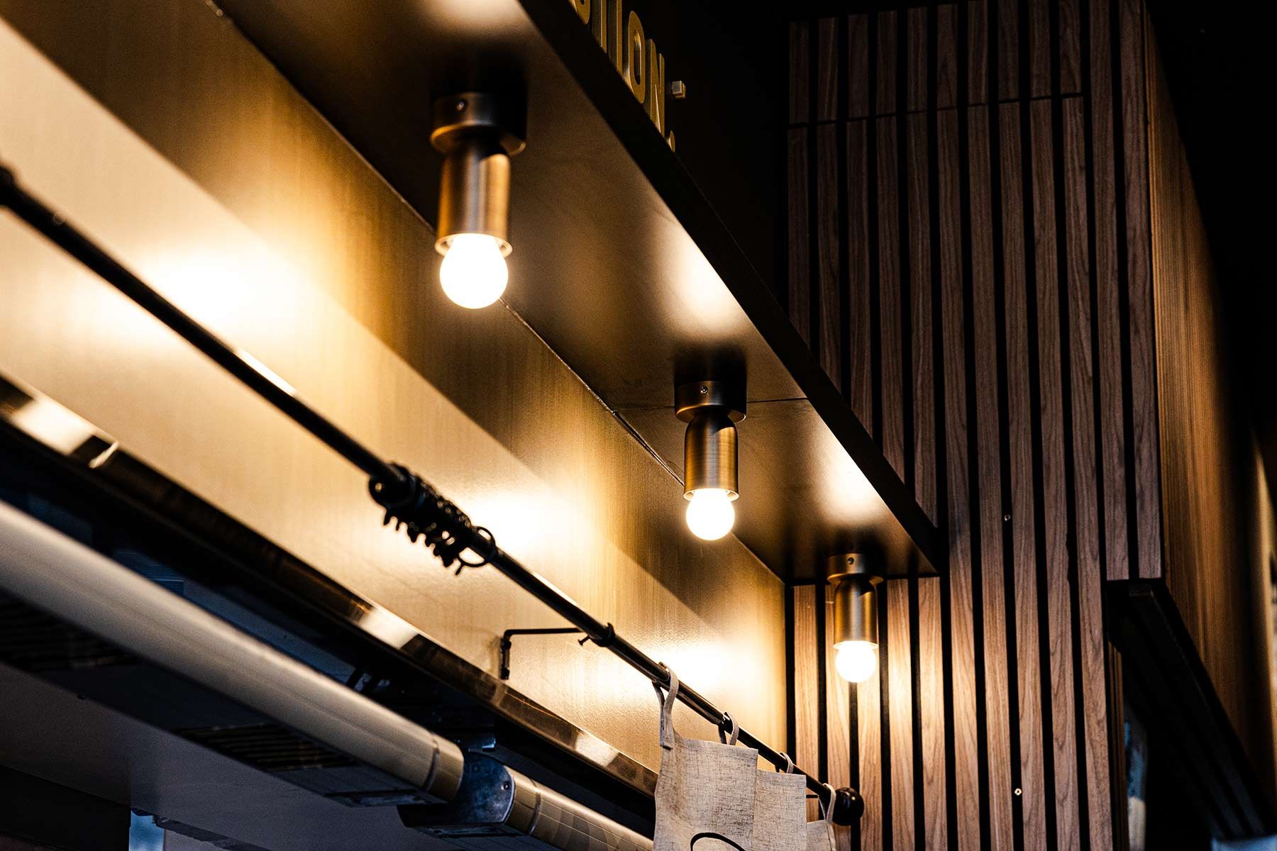 Ceiling View With Three Warm Glowing Light Bulbs — JMB Electrical Services In Port Kembla, NSW