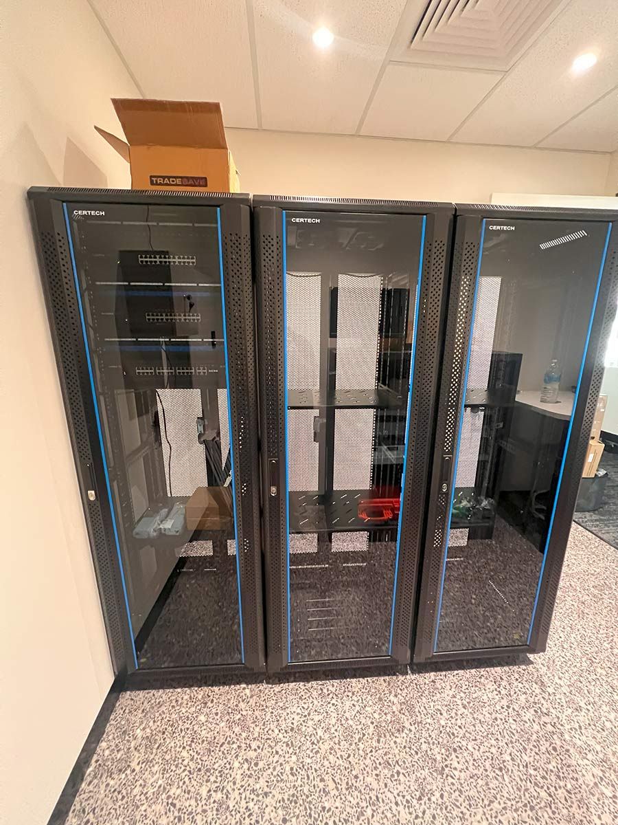 Three Black Server Racks With Blue Accents — JMB Electrical Services In Port Kembla, NSW