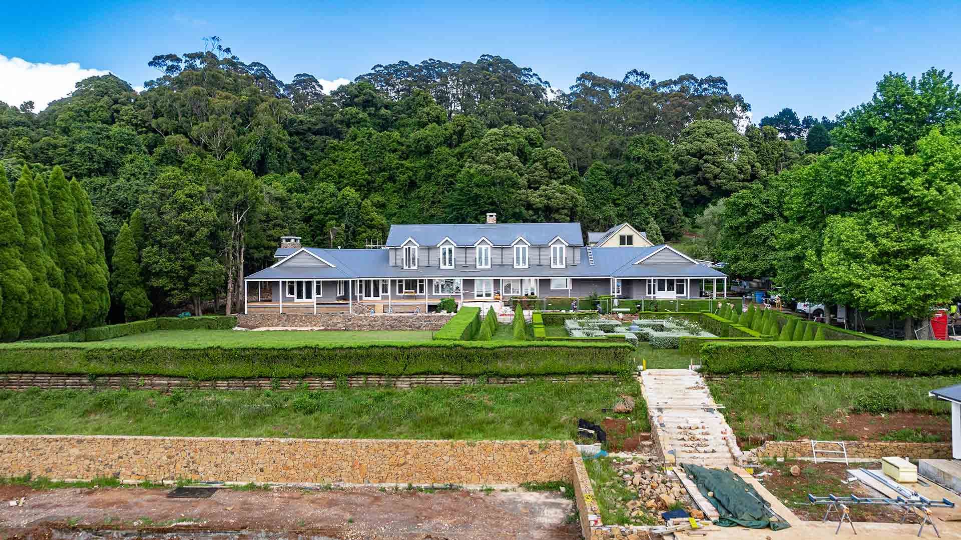 Estate With a Large House Featuring a Blue Roof — JMB Electrical Services In Port Kembla, NSW