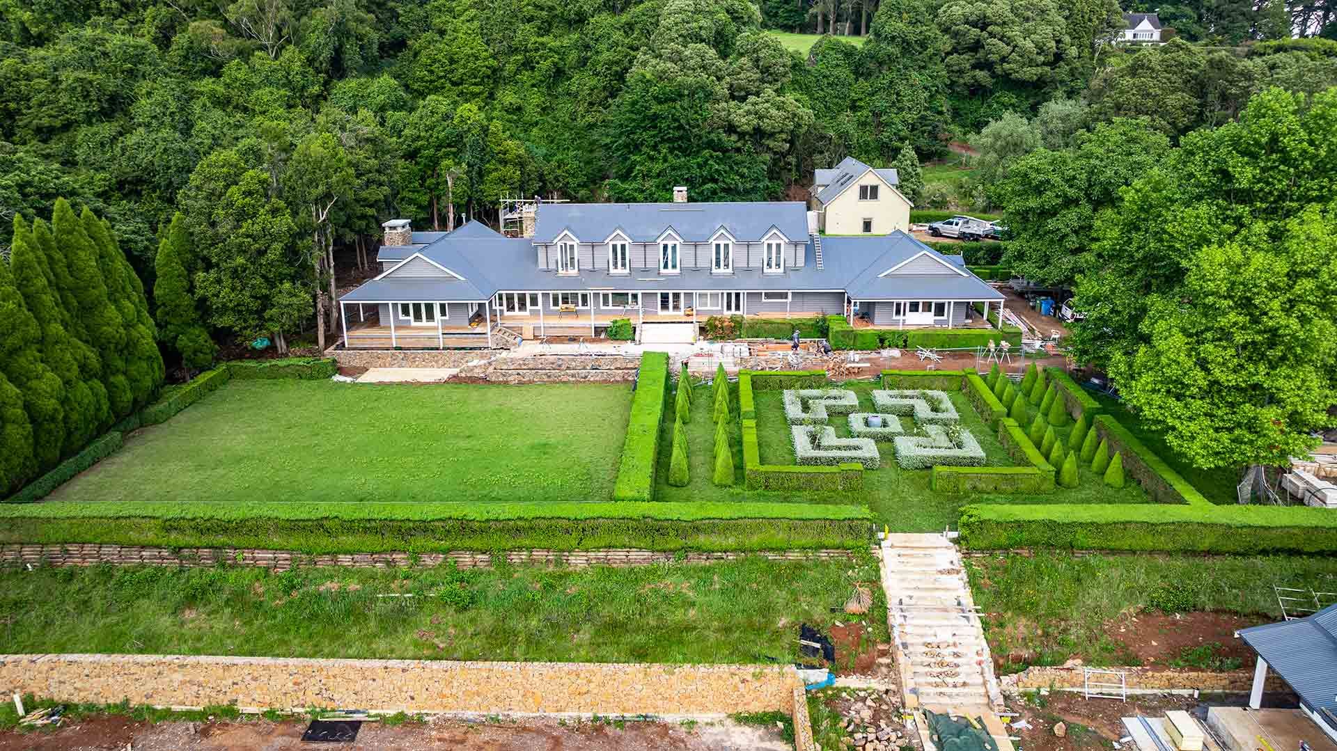 Large House With a Slate Blue Roof — JMB Electrical Services In Port Kembla, NSW