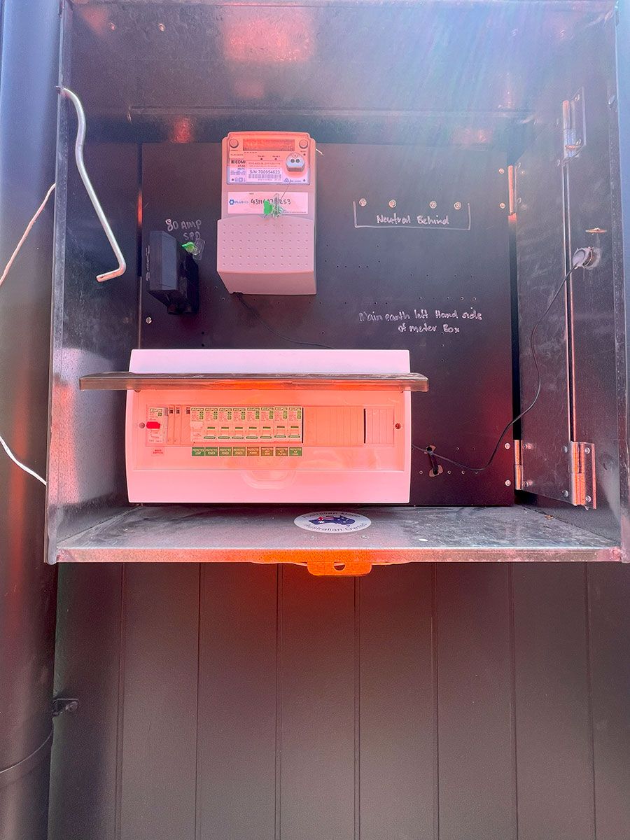 An Open Metal Electric Meter Box With a Digital Meter and Circuit Board — JMB Electrical Services In Port Kembla, NSW