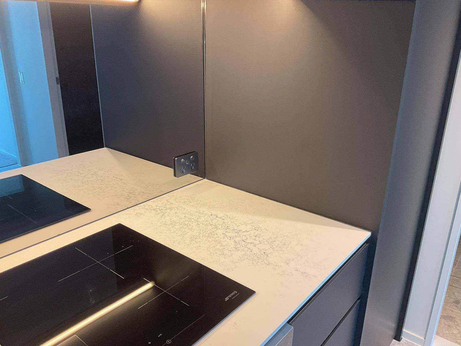 Modern Kitchen With a Sleek Induction Cooktop — JMB Electrical Services In Port Kembla, NSW