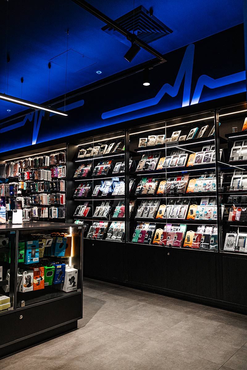 Shelves Display Various Phone Cases and Gadgets — JMB Electrical Services In Port Kembla, NSW