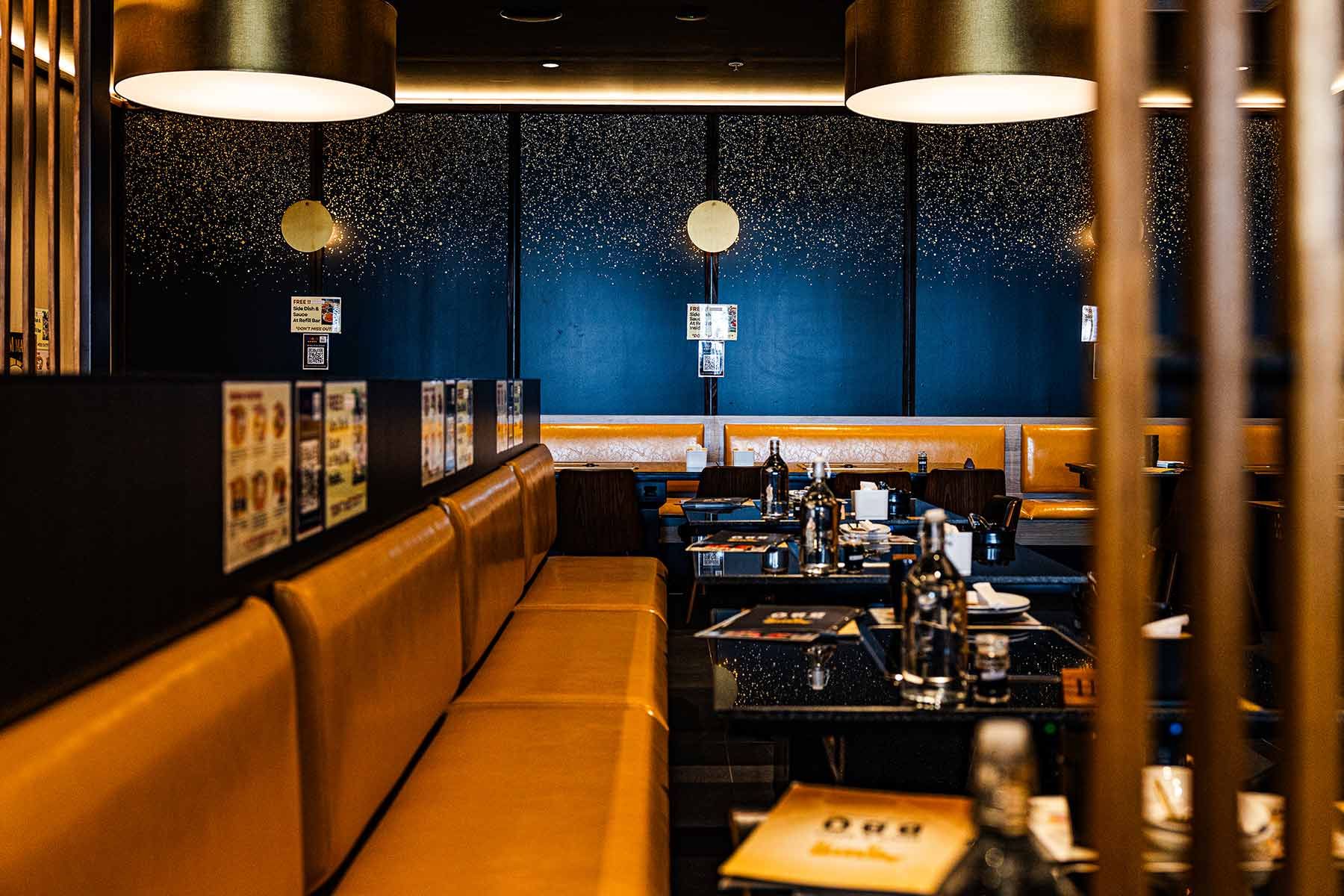 Restaurant Interior With Mustard Yellow Seating — JMB Electrical Services In Port Kembla, NSW