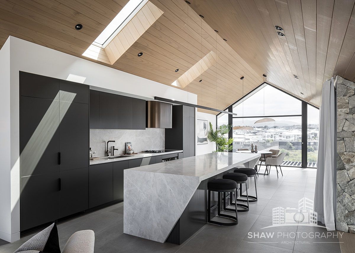 A Kitchen With a Large Island in the Middle — JMB Electrical Services In Port Kembla, NSW