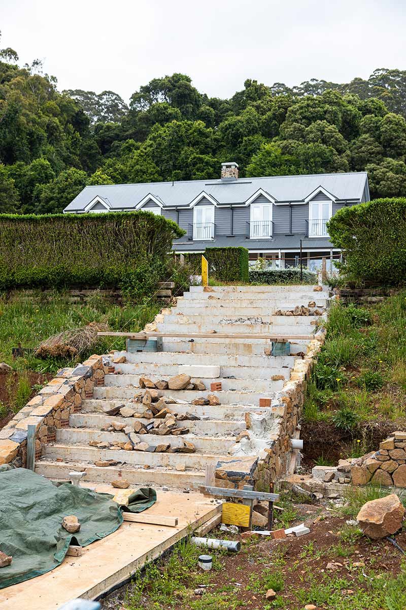 A Partially Constructed Stone Staircase — JMB Electrical Services In Port Kembla, NSW