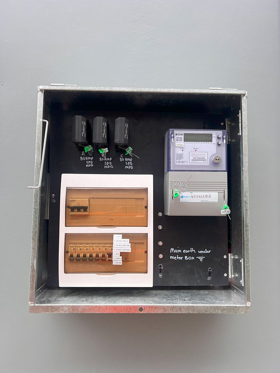Open Electrical Meter Box on a Gray Wall — JMB Electrical Services In Port Kembla, NSW