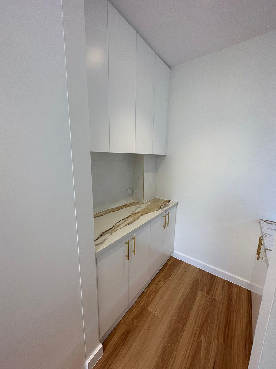 Kitchen Corner With White Cabinets — JMB Electrical Services In Port Kembla, NSW