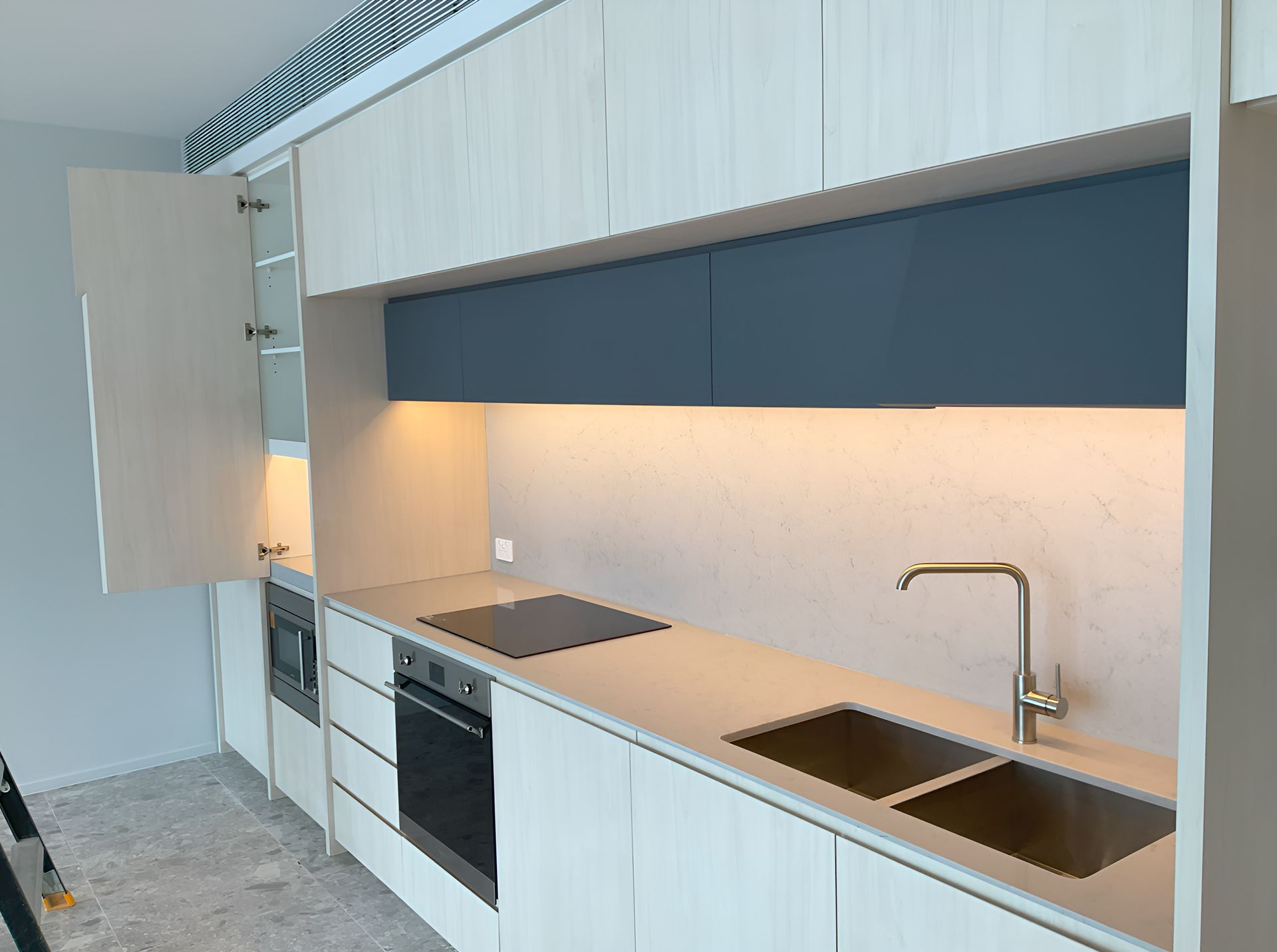 Modern Kitchen With Light Wood Cabinets — JMB Electrical Services In Port Kembla, NSW