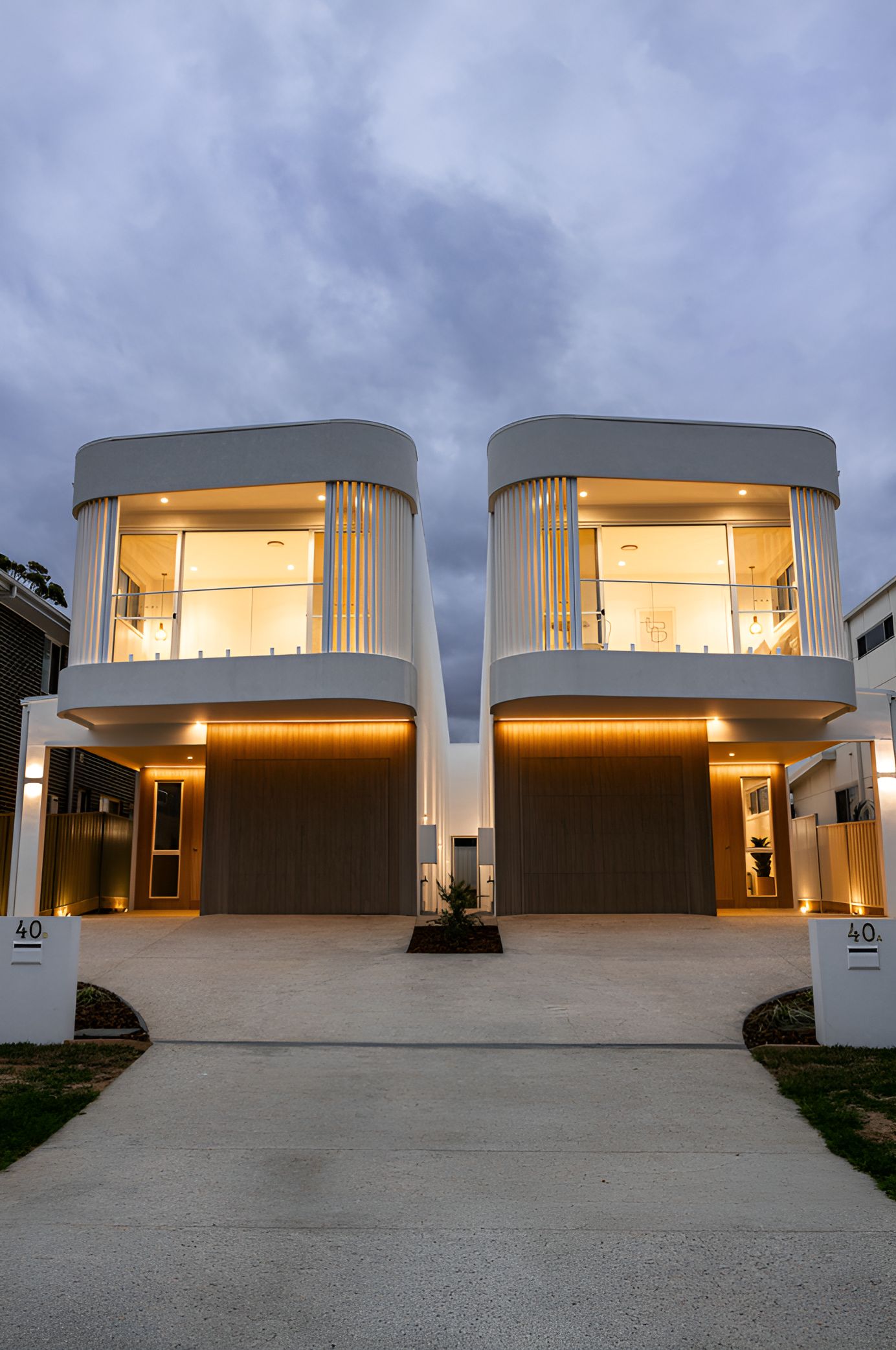 Twin White Houses With Large Upper Windows — JMB Electrical Services In Port Kembla, NSW