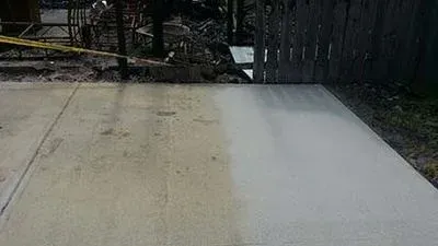 A before and after picture of a concrete driveway.