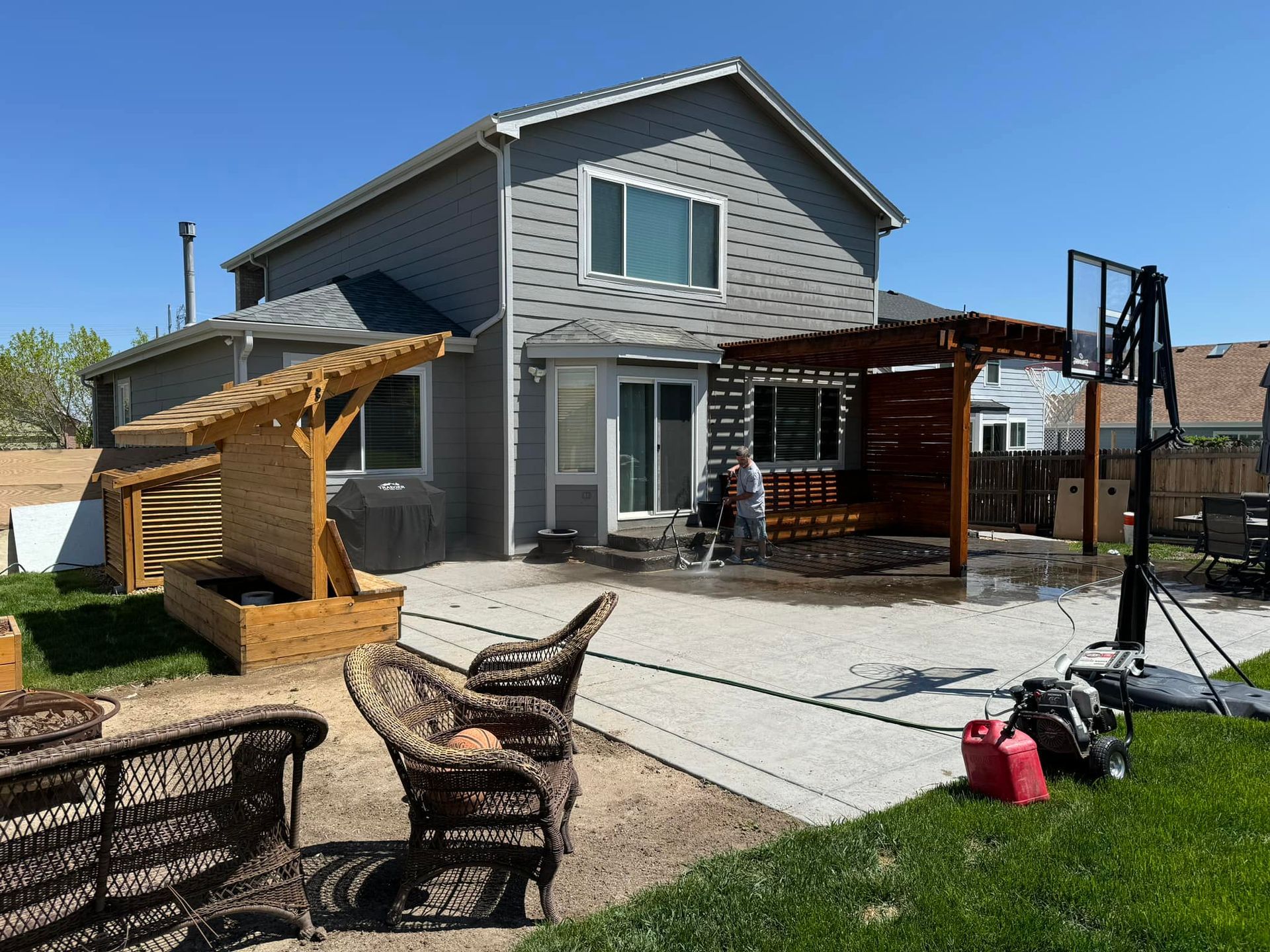 A house with a basketball hoop in the backyard