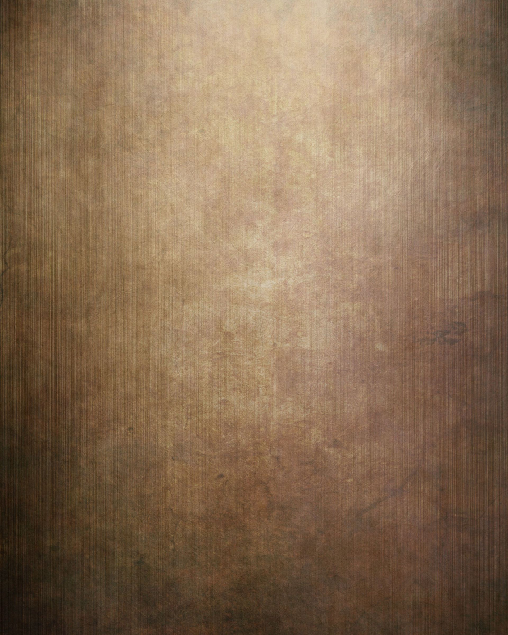 A close up of a brown background with a grainy texture.