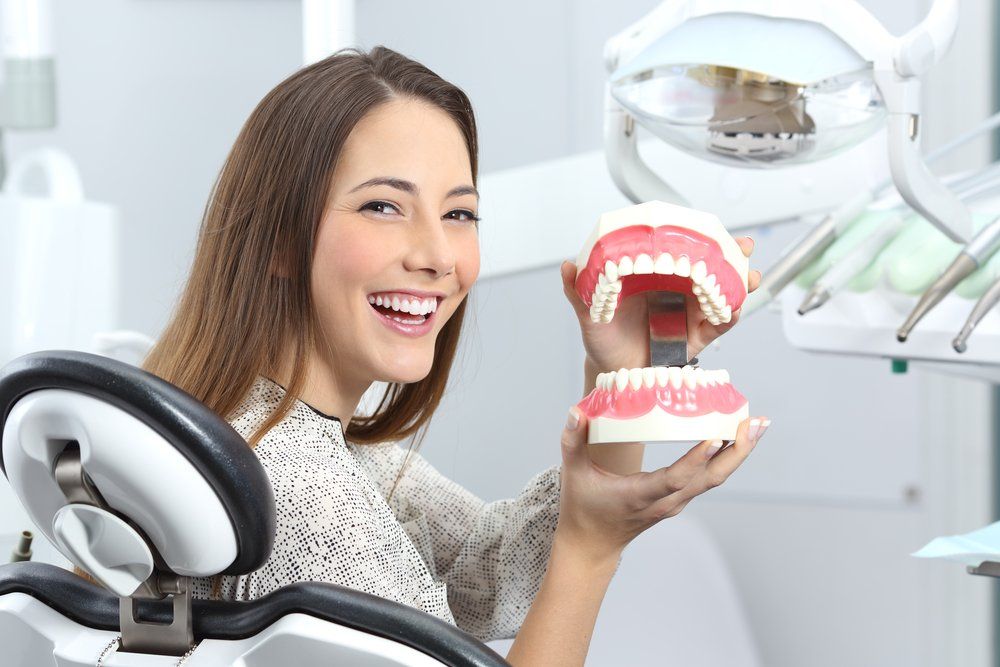 Dentist Patient Smiling With Perfect Teeth — Ballina Denture Clinic Michael J Parker in Ballina, NSW
