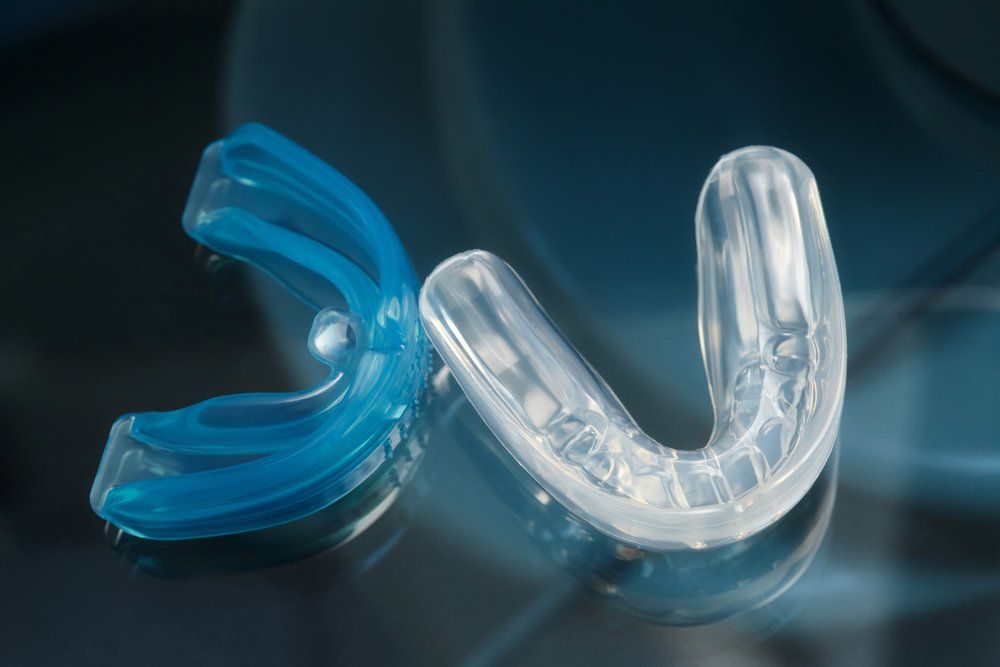 Two Mouth Guards, One Blue and One White — Ballina Denture Clinic Michael J Parker in Lennox Head, NSW