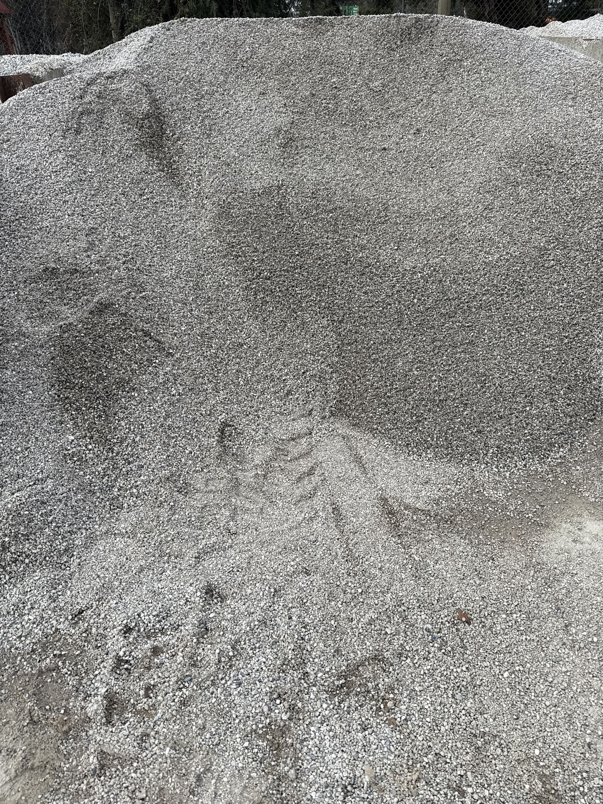 Pile of small, gray gravel on a concrete surface. — Wodonga Sand & Soil in Wodonga, VIC