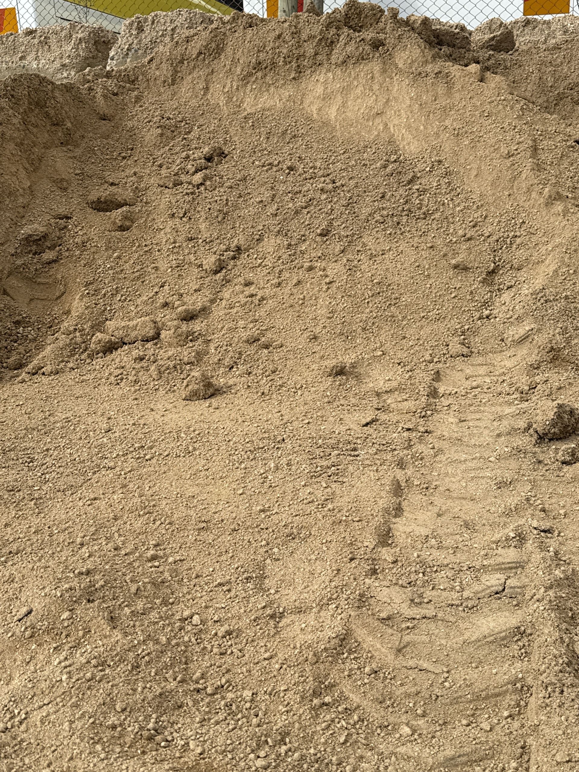Pile Of Light Brown Sand, Likely Construction Material, With Tire Tracks Visible — Wodonga Sand & Soil in Wodonga, VIC