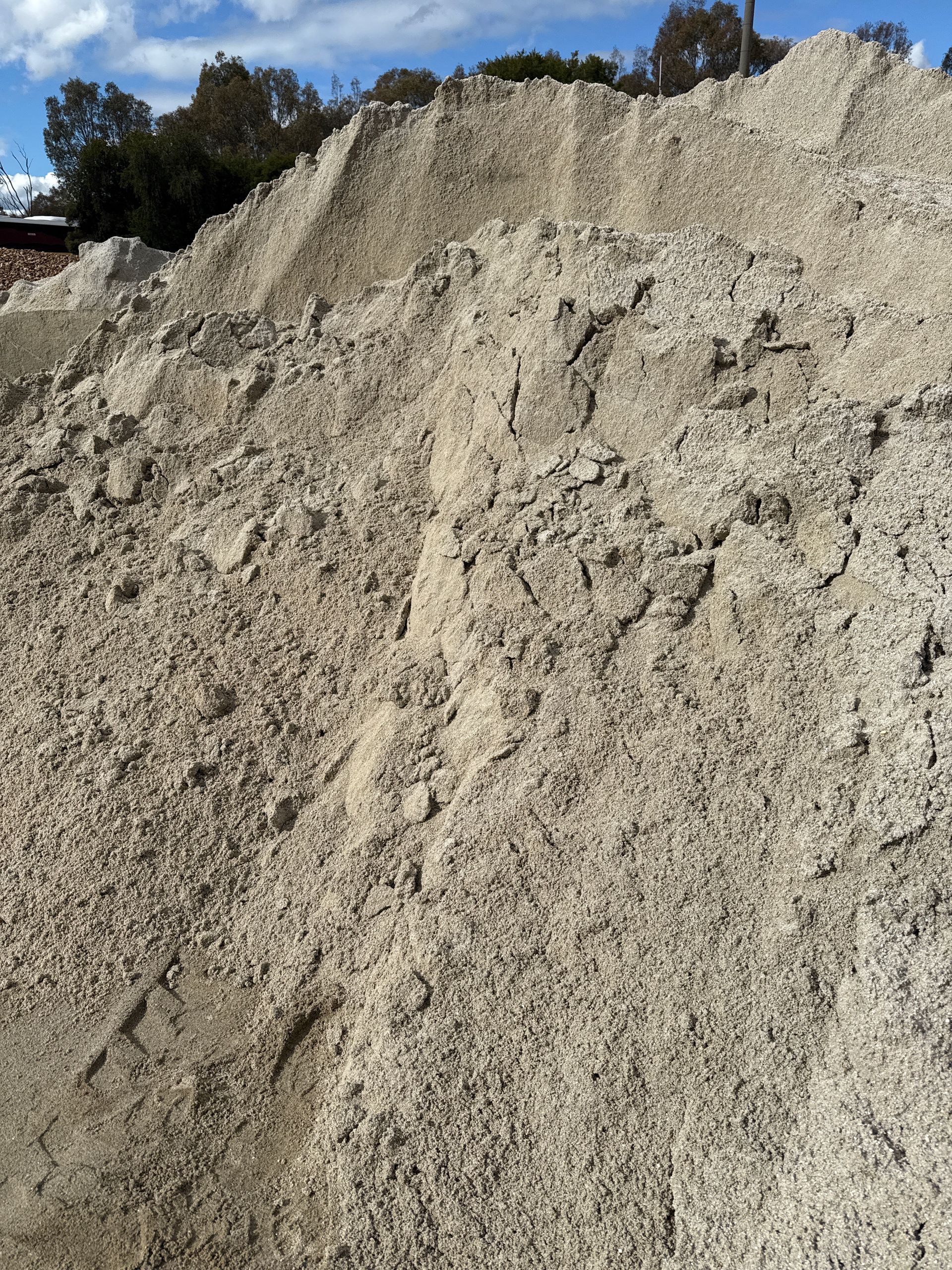 Pile Of Light-colored Sand Or Gravel Outdoors, Likely For Construction — Wodonga Sand & Soil in Wodonga, VIC