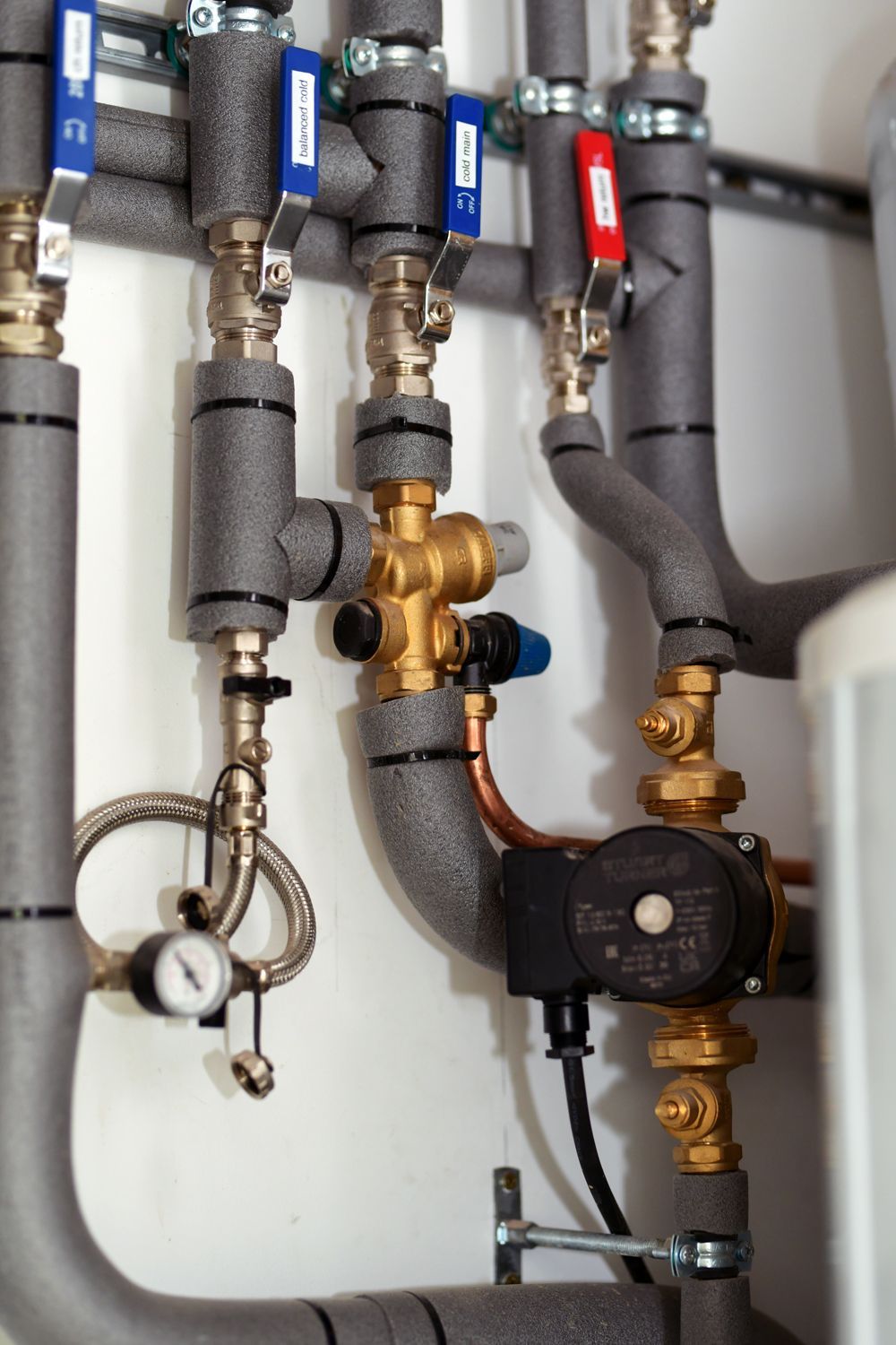 A bunch of pipes and valves are connected to each other  in a Construction Management in East Sussex