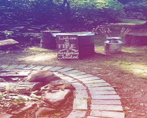 Fire pit setup with sign: 