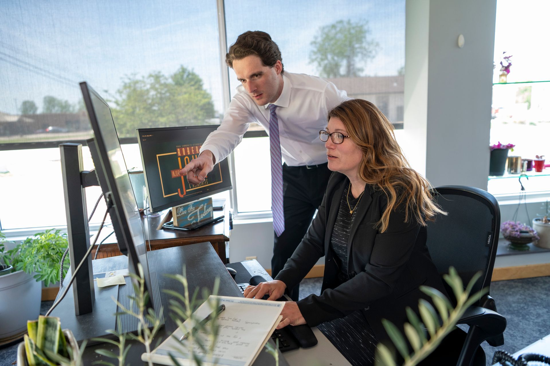 Newburgh slip and fall attorneys reviewing a case at Robert John & Associates