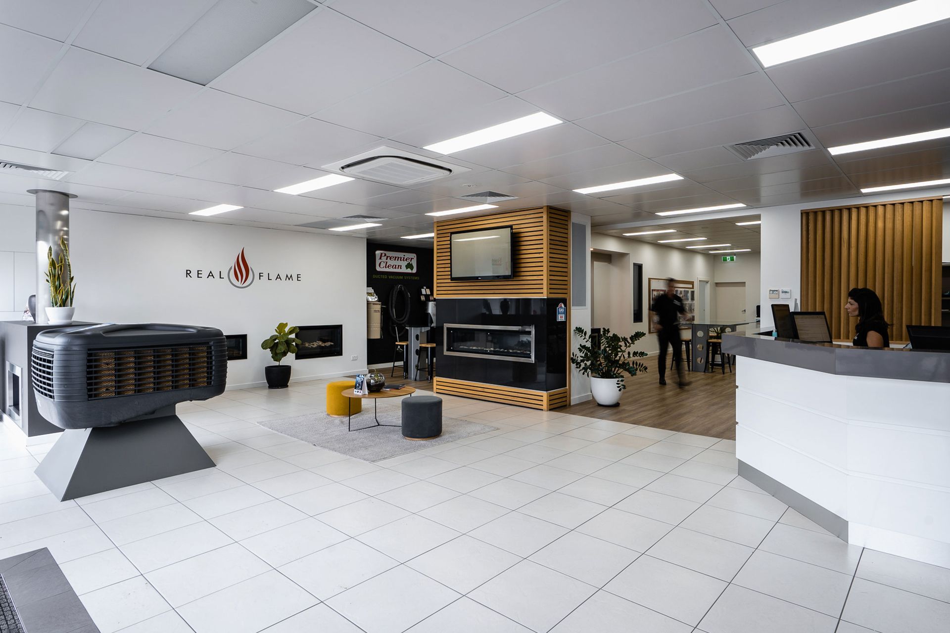 Border Heating & Cooling reception counter in a showroom with a fireplace