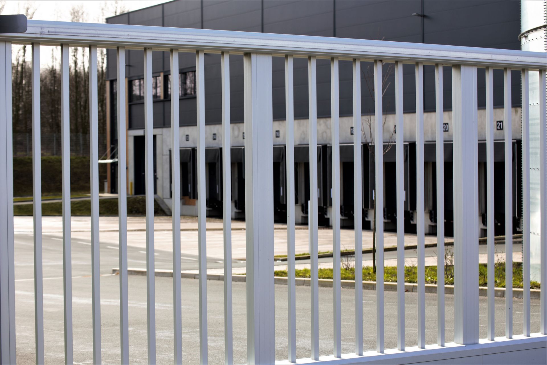 Building With Steel Fence — Dayton, OH — B & B Fence & Decks LLC